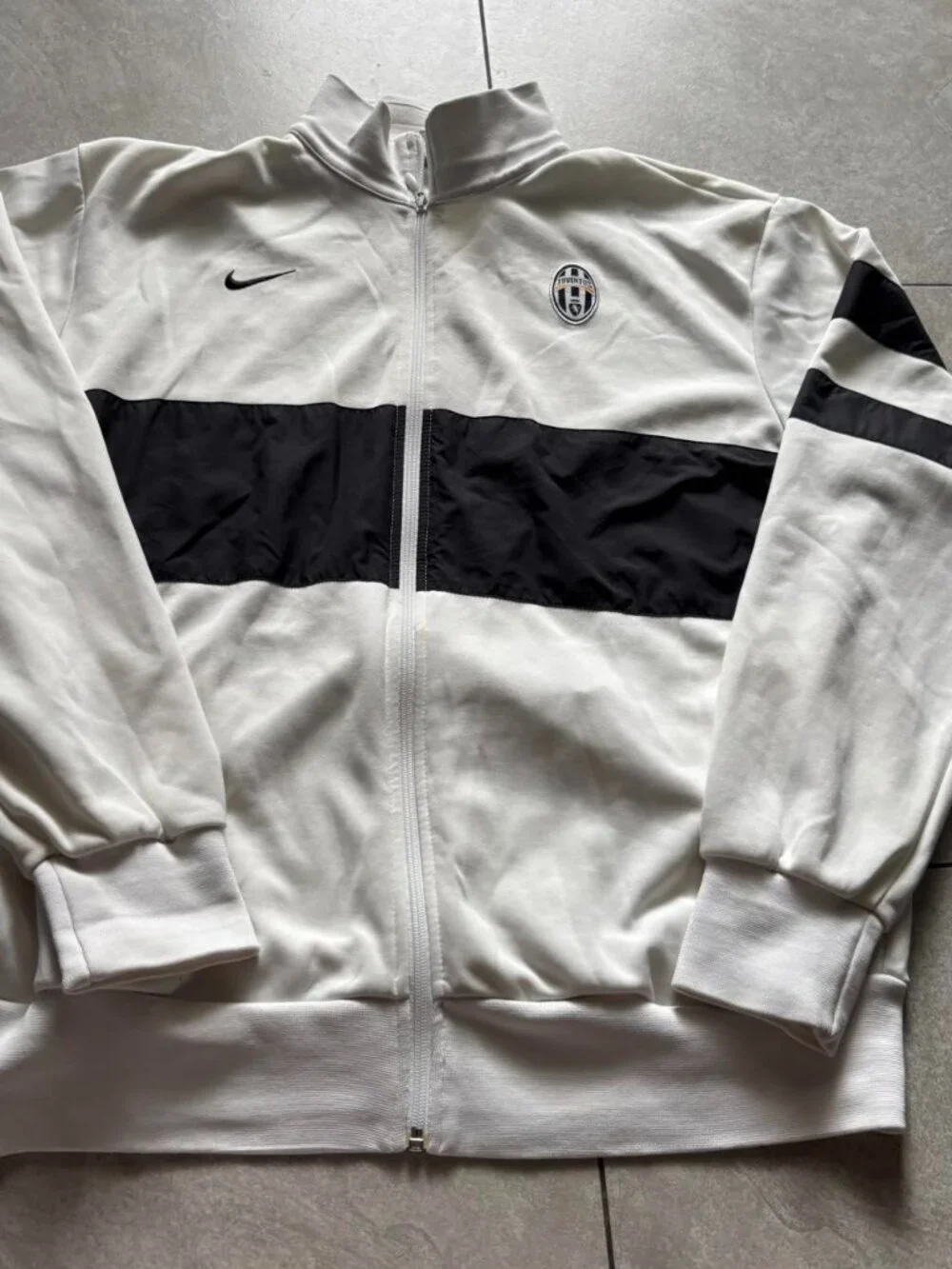 Vintage Nike Juventus white track jacket with black horizontal stripe across the